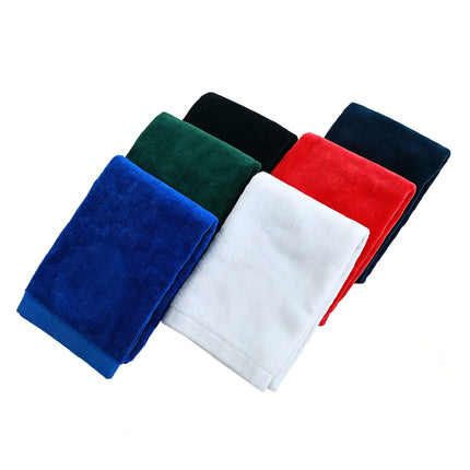 Eliteshine MH-F cotton golf towels in six colours — blue, forest green, black, white, red, and navy — folded and fanned on white background showing trifold edge detail