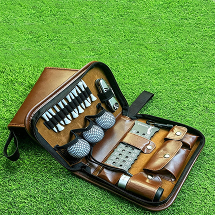 Top-down lifestyle view of Eliteshine W01 brown golf accessory pouch open on grass with full accessory load including tees, balls, and tools