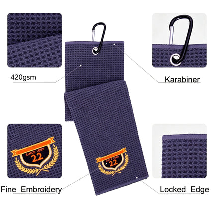 Eliteshine MH-A golf towel in navy — detail view showing 420/450/500gsm waffle texture, embroidered badge, carabiner clip, and overlock edge
