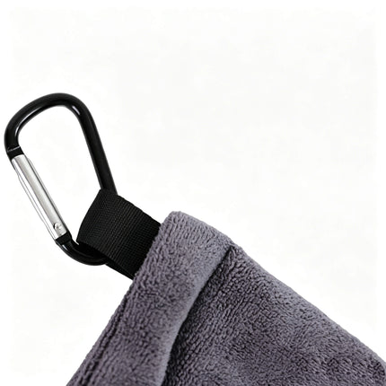 Close-up of Eliteshine MH-G golf ball towel karabiner clip — black metal carabiner with nylon webbing loop attached to grey 400gsm super microfibre towel on white background