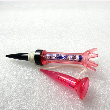 Right side view of Eliteshine T105 magnetic golf tee in pink showing transparent body, rubber cap, and cone retriever tee with cord